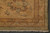 Corner detail of the gold border, brown vine tracery and plain green outer band