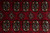 Close-up of two rows of octagonal guls with stepped diamond motifs between them