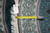 Tape measure and dealer tag marked Rug No 60273, size 6' x 6', lying on the border