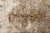 Close view of the lobed cream medallion, red outlines, blue buds and small rosettes