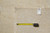 Reverse of the rug with tape measure and inventory tag numbered 5574 marked 8.10 x 11