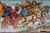 Close detail of the chariot drawn by pale horses with winged figures above a walled city