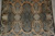 Close view of the field centre showing lobed cartouches and leaf forms on grey and black