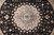 Close view of the central rosette, rings of rose and cream petals around a green core