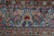 Straight-on detail of the main border, paired boteh, footed vases and rosette guard stripes
