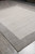 Angled corner view showing the grey border turning and the open ivory centre field