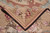 Corner turned over on itself, dark selvedge edge and shell basket motif with loose end threads