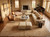 Rug in a sunlit living room beneath a cream sectional, marble table, fireplace and grand piano