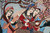 Three musicians in detail: harpist, cup holder in red, lute player under blossom
