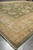 Perspective view along one long side, ivory and gold border with green field beyond