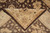 Corner of the rug turned back to show the reverse alongside the pattern on the pile