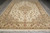 8'9" x 12' wool and silk Tabriz design rug photographed at an angle on grey flooring