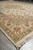 Close corner angle of layered borders with rose blossoms, olive leaves and plush wool pile