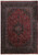 Full view of 10' x 13' Persian rug with deep red field and navy floral medallion