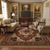 Traditional living room styled with burgundy Serapi area rug beneath a round cherry coffee table