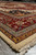 Low angle across the pile emphasizing thick wool, gold border and black blue spandrel