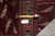 Tape measure and inventory tag PIX 23746 placed on the rug border for size verification