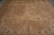Angled floor view showing ivory spandrels and stepped medallion of this vintage Persian wool rug