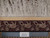 Ivory fringe and maroon lion guard border measured against a ruler confirming authentic handmade weave