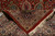 Folded corner revealing tight back weave, cotton fringe and paisley boteh motifs in the field