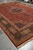 Living room scale 11'6 x 16 Tabriz rug viewed diagonally showing medallion, border and fringe