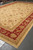 13 by 20 Chobi Peshawar rug laid out showing beige field and coral red border