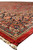Side angle along the edge showing selvage, cream fringe and layered floral borders in red