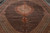 Angled floor view of the wool and silk Tabriz Mahi rug showing medallion and scalloped spandrels