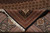Folded corner revealing the tight hand-knotted back, cotton fringe and high knots per square inch