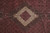 Close detail of the ivory diamond medallion filled with miniature Herati rosettes on black ground