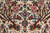 Field detail showing paired blue birds, red blossoms and rust brown tree of life branches