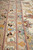 Macro of the ivory guard borders with blue, gold and rose flowerheads woven in silk