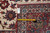 Back tag reading 12 x 17.7 beside a tape measure across red border and ivory field