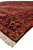 Standing corner view of the 11'2" x 14'7" wool rug with camel outer border