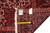 Reverse of the rug with tape measure, inventory tag and even knotting across the foundation