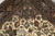 Corner detail showing navy cartouche border with cranes, gazelles and fine wool pile weaving