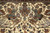 Mirrored mounted hunters in turbans spearing tigers across the ivory field of this Tabriz rug