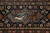 Border panel detail with greyhounds chasing a deer inside a lilac cartouche on navy