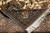 Folded corner revealing the back of the hand-knotted rug, cotton fringe and tight knot density