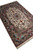 Side perspective showing silky pile sheen, cream fringe and rose cartouche border of the Isfahan weave