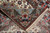 Folded corner of the 5x8 Isfahan rug revealing dense knotting, selvedge edge and cream fringe