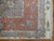 Corner detail of rose border, lavender guard stripes and ivory selvage with scrolling floral vines