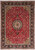 8'3" x 11'8" Persian Tabriz rug shown flat with ivory medallion on berry red field