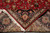 Back of the rug folded over, revealing fine knotting, cotton foundation and crisp design clarity