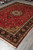 8'3" x 11'8" Tabriz rug from Persia displayed lengthwise on grey tile with medallion centered