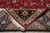 Folded corner revealing tight hand-knotted weave, cotton fringe and knots per square inch