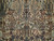 Close-up of brown deer, grazing antelope and paired birds woven on ivory wool pile