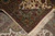Folded corner showing the fine hand-knotted back, cotton foundation and ivory fringe end