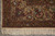 Corner detail with woven deer, pheasants and white blossoms on camel colored border