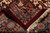 Folded back corner revealing dense hand-knotted wool weave, cotton foundation and ivory fringe ends